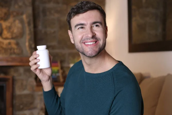 Close Portrait Handsome Young Man Holding White Plastic Jar Medicines — Stockfoto