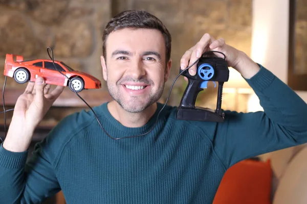 Close Portrait Handsome Young Man Holding Toy Car Remote Control — 스톡 사진