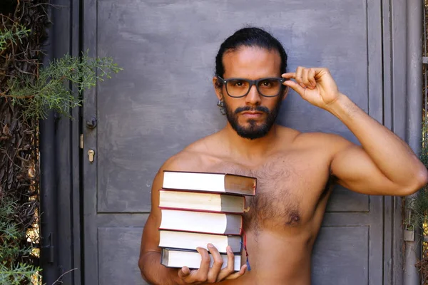 Close Portrait Handsome Shirtless Young Man Stack Books Grey Wall — 스톡 사진