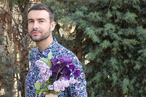 Close Portrait Handsome Young Man Beautiful Blossoming Lilac Flowers Park — Fotografia de Stock