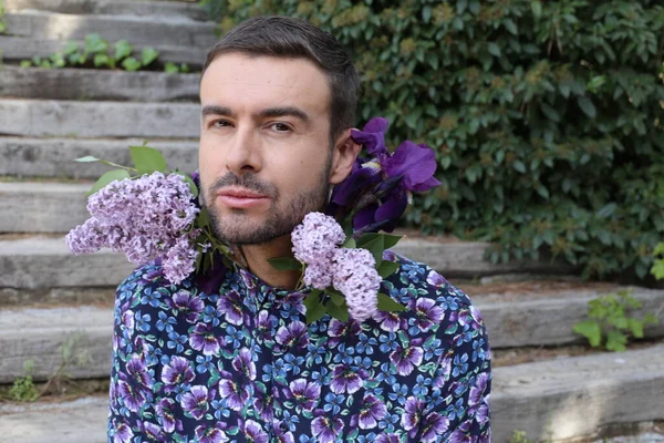 Close Portrait Handsome Young Man Beautiful Blossoming Lilac Flowers Park — Zdjęcie stockowe