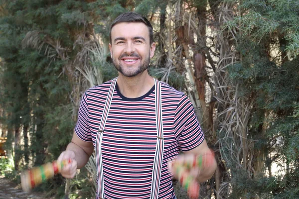 Close Portrait Handsome Young Man Juggling Sticks Outdoors — Foto Stock