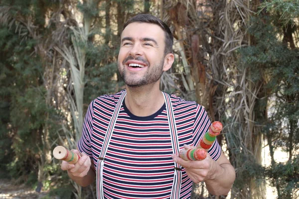 Close Portrait Handsome Young Man Juggling Sticks Outdoors — Foto Stock