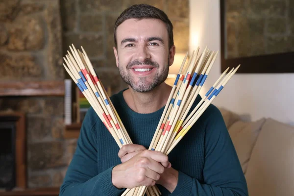 Close Portrait Handsome Young Man Holding Sticks Home — Foto Stock