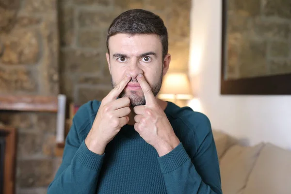 Close Portrait Handsome Young Man Putting Fingers His Nose Home — Stockfoto