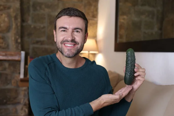 Close Portrait Handsome Young Man Holding Ripe Cucumber Home — Φωτογραφία Αρχείου