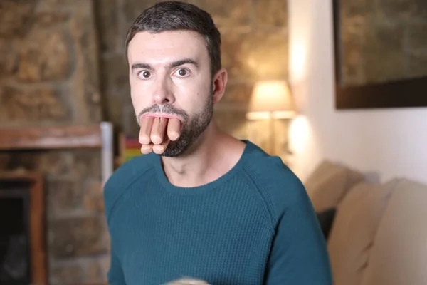 Close Portrait Handsome Young Man Sausages Mouth Home — Stock Photo, Image