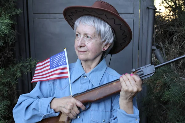 Close Portrait Mature Woman Cowboy Hat Blue Shirt Holding Gun — Stock Photo, Image