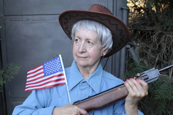 Close Portrait Mature Woman Cowboy Hat Blue Shirt Holding Gun — Stock Photo, Image