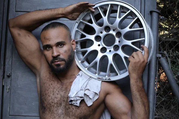 Close Portrait Handsome Shirtless Young Man Holding Car Wheel Front — 스톡 사진
