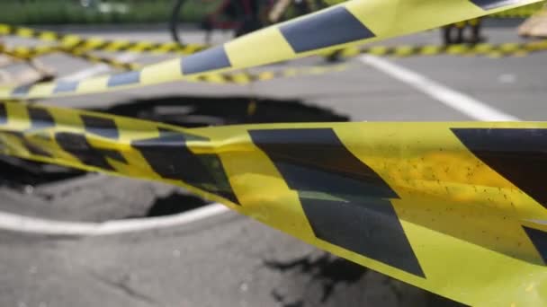 Dangerous Stretch Road Damaged Asphalt Accident Site Fenced Black Yellow — Vídeo de Stock