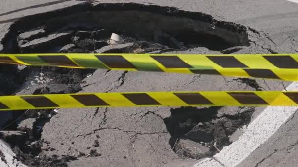 Dangerous Stretch Road Damaged Asphalt Accident Site Fenced Black Yellow — Vídeo de Stock