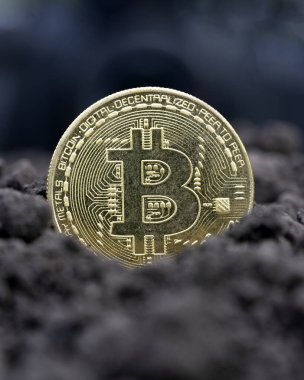 The concept of extraction and mining of cryptocurrency. Bitcoin dug up in the ground