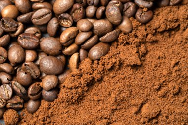 Top view of roasted coffee beans for background and texture. A pile of roasted and ground coffee beans can be used as a background and texture.