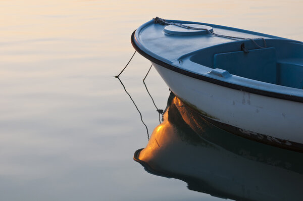 Small boat in sunrise light