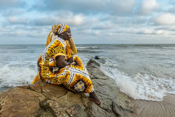 African Woman Long Dress Sitting Stone Cliff Coast Accra Ghana — Stockfoto