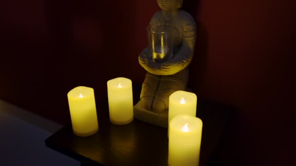 Oriental spa arrangement with candle and stones in black — Stock Video