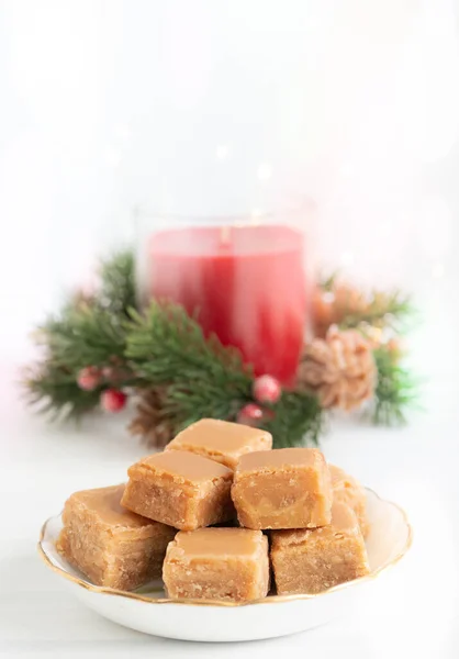 Caramel Fudge Plate Christmas Candle Lights Light Background Copy Space — Foto de Stock