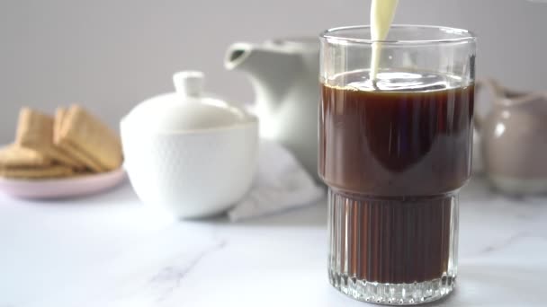 Milk Being Poured Large Coffee Glass Light Background Selective Focus — Wideo stockowe