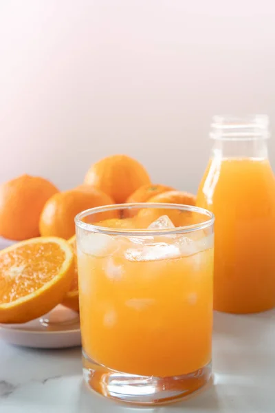 Glass of Freshly Squeezed Orange Juice on a Table Selective Focus with Copy Space Vertical