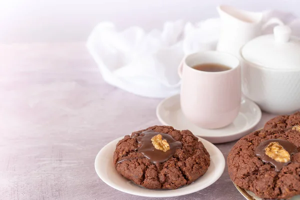 Plate of New Zealand Chocolate Afghan Cookies with Cup of Tea, milk jug and sugar with Copy Space