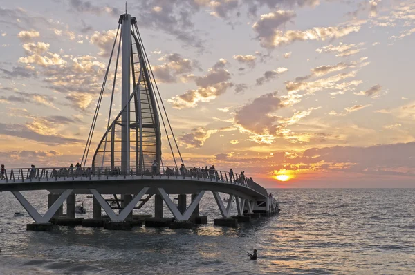 Ocean pier in setting sun — Stock Photo, Image