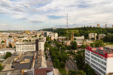 Kyiv, Ukraine  July 08, 2017: A beautiful panorama of Podil area. Aerial view on residential and industrial areas. A lot of buildings of different architectural style. Historical area, Dnipro river.
