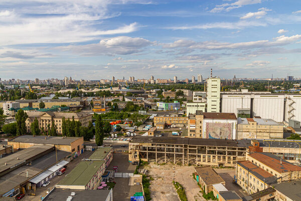 Kyiv, Ukraine  July 08, 2017: A beautiful panorama of Podil area. Aerial view on residential and industrial areas. A lot of buildings of different architectural style. Historical area, Dnipro river.