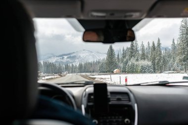 Nice view from a car on city and mountains. Travel destination. 