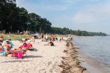 Sweden, Ahus  August 4, 2022: Crowded beach on a hot sunny summer day 