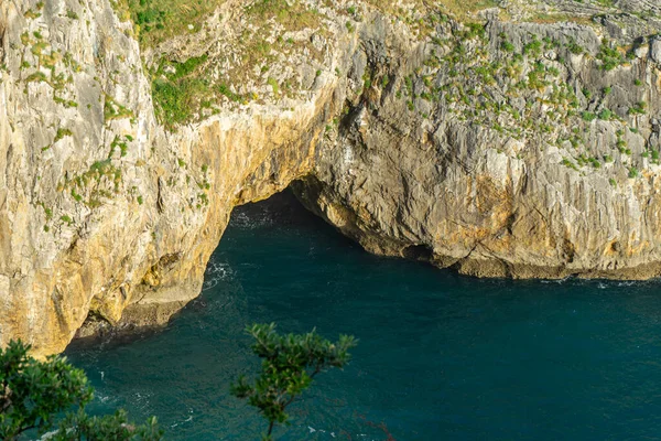 lagoon among the rocks. Top view of the entrance to the sea cave