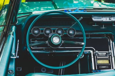 retro car dashboard interior. View of the steering wheel and dashboard of an old vintag car