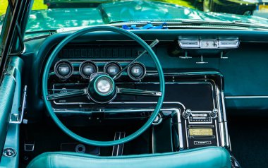 Interior view of old vintage car. View on dashboard of classic car.