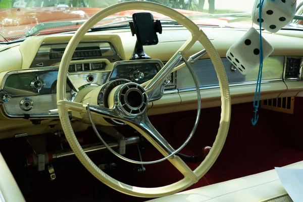 Interior view of old vintage car. View on dashboard of classic car.