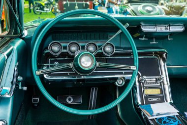 retro car dashboard interior. View of the steering wheel and dashboard of an old vintag car