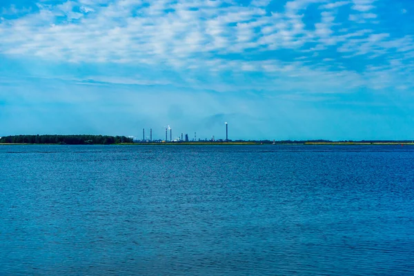 Water Surface Ripples Water Clouds Blue Sky Industrial Pipes Smoke — Stockfoto