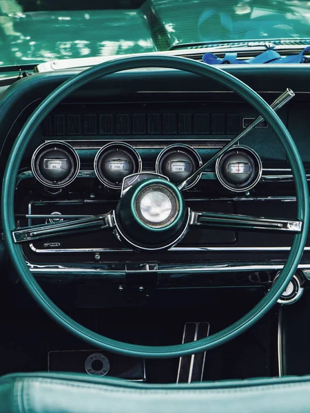 Interior view of old vintage car. View on dashboard of classic car.