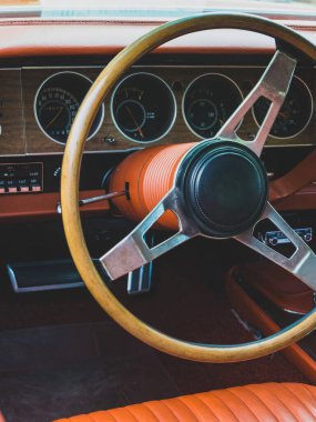 Interior view of old vintage car. View on dashboard of classic car.
