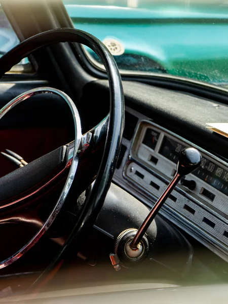 Interior view of old vintage car. View on dashboard of classic car.