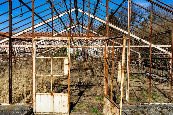 Abandoned greenhouse. Ruined abandoned greenhouse complex.