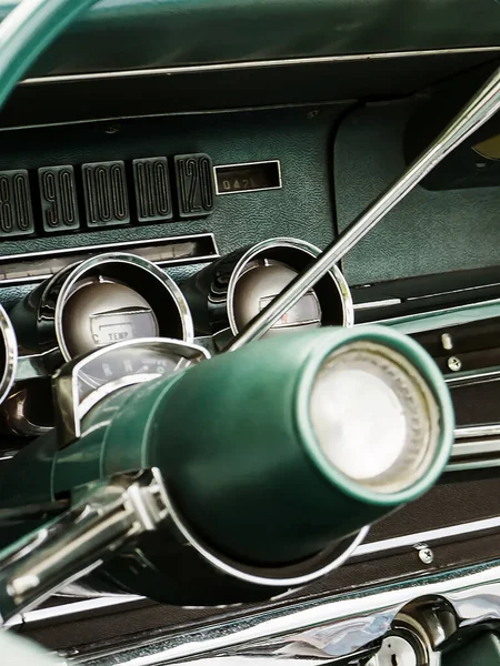 retro car dashboard interior. View of the steering wheel and dashboard of an old vintag car.