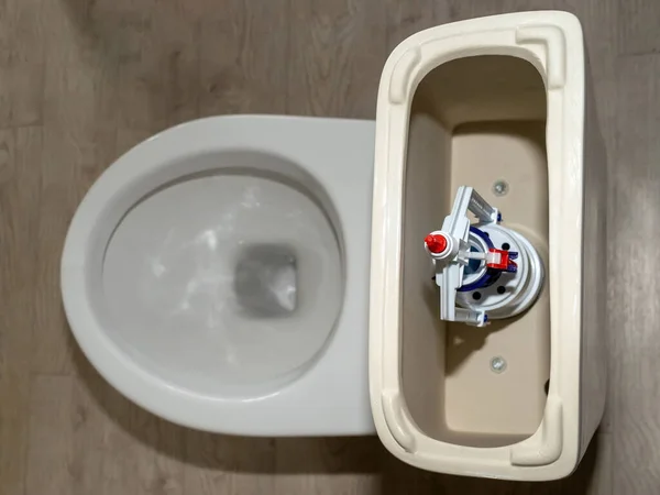 New White Toilet Tank Open Lid Flush System Top View — Zdjęcie stockowe
