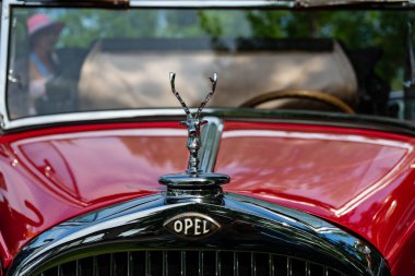 Stepnica, Poland - 06 04 2022: old vintage OPEL collectible car with the emblem of the 1921 model and the head of a deer.