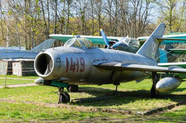 decommissioned MiG-17 at the site for inspection.