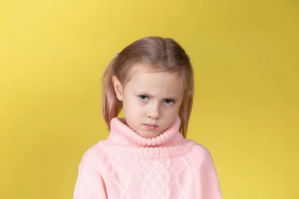 Sad Caucasian Elementary Age School Girl Looking Camera Yellow Background — Stock Photo, Image