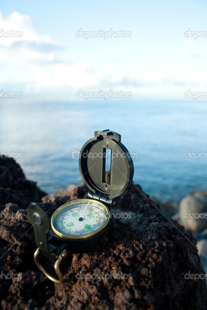 Compass at lava cliff