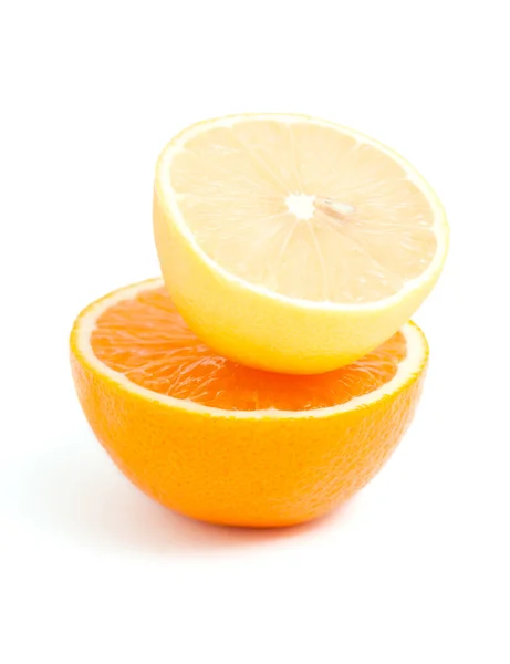 Halv citron på orange isolerad på vit bakgrund Stockbild
