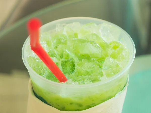Closeup on top cup of icy milk green tea — Stock Photo, Image