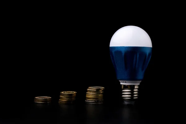 LED Bulb with money — Stock Photo, Image