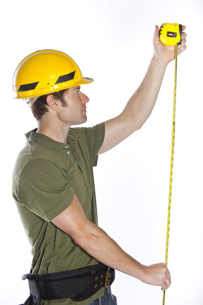 Construction worker measuring